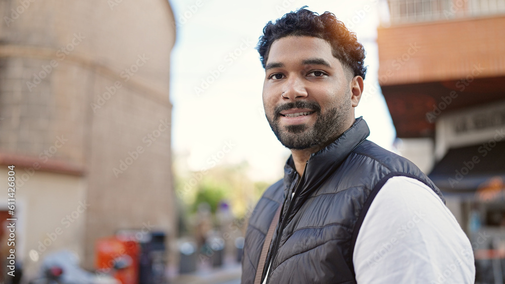 African american man smiling confident standing at coffee shop terrace African american man smiling confident standing at coffee shop terrace