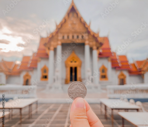 Photography buddha statue at temple on coin