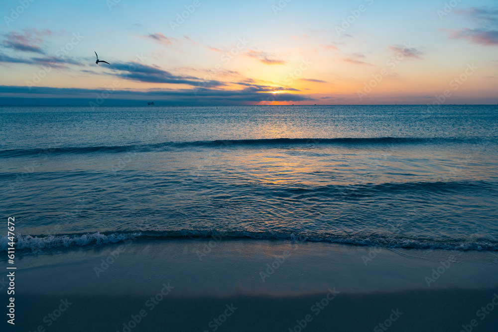 beautiful sunset with mediterranean sea water on the summer beach