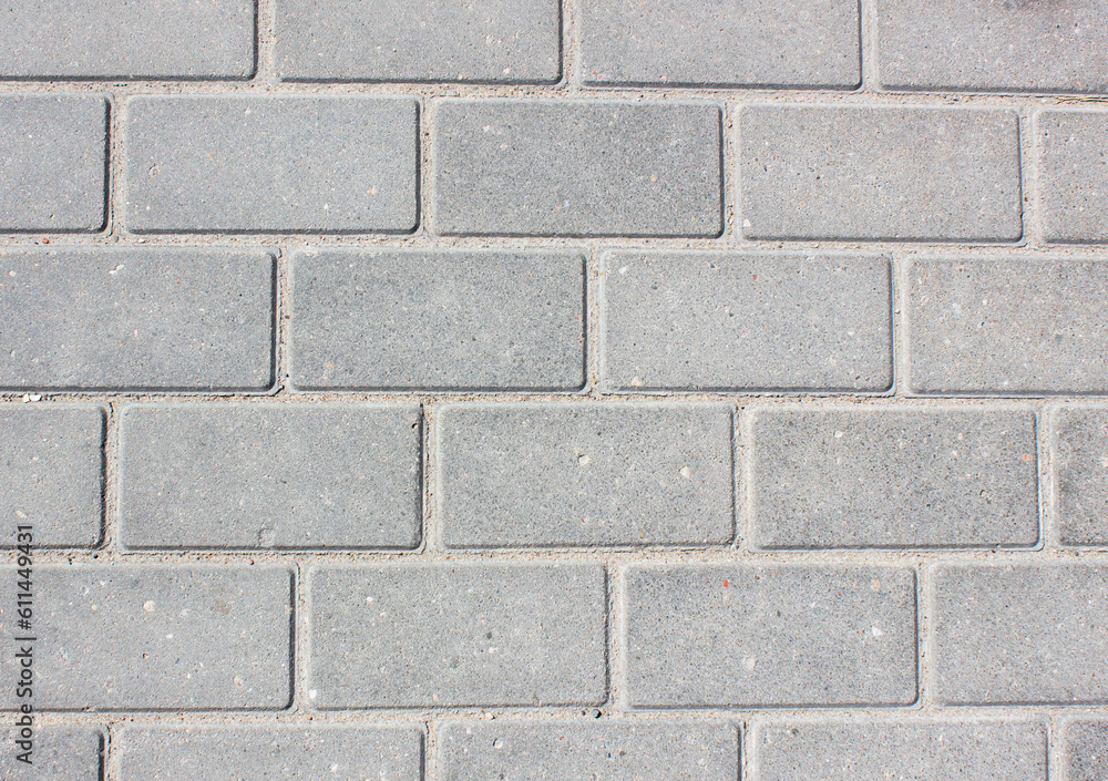 Brick paving slabs.Gray background of a brick pavement.Background of a block of gray stone tiles Surface of a gray brick.Stone pavement slab texture. Road,tile,concrete slab. Brick paving slabs.Gray background of a brick pavement.Background of a block of gray stone tiles Surface of a gray brick.Stone pavement slab texture. Road,tile,concrete slab.