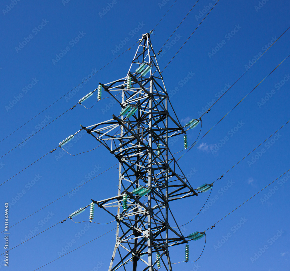 Power line. Power line against the blue sky. Electricity transmission.Power line support. Power line. Power line against the blue sky. Electricity transmission.Power line support.