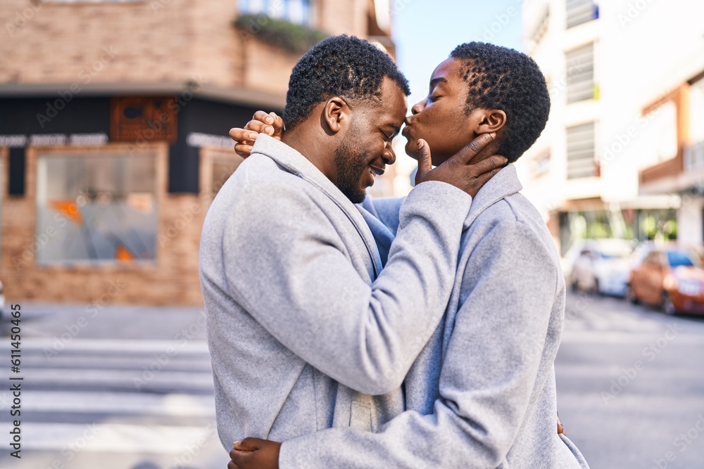 Fototapeta premium Man and woman couple hugging each other standing at street