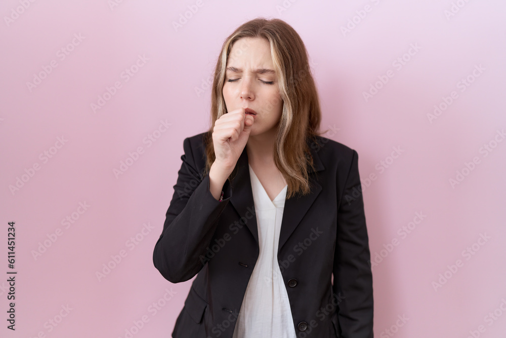 Young caucasian business woman wearing black jacket feeling unwell and coughing as symptom for cold or bronchitis. health care concept. Young caucasian business woman wearing black jacket feeling unwell and coughing as symptom for cold or bronchitis. health care concept.