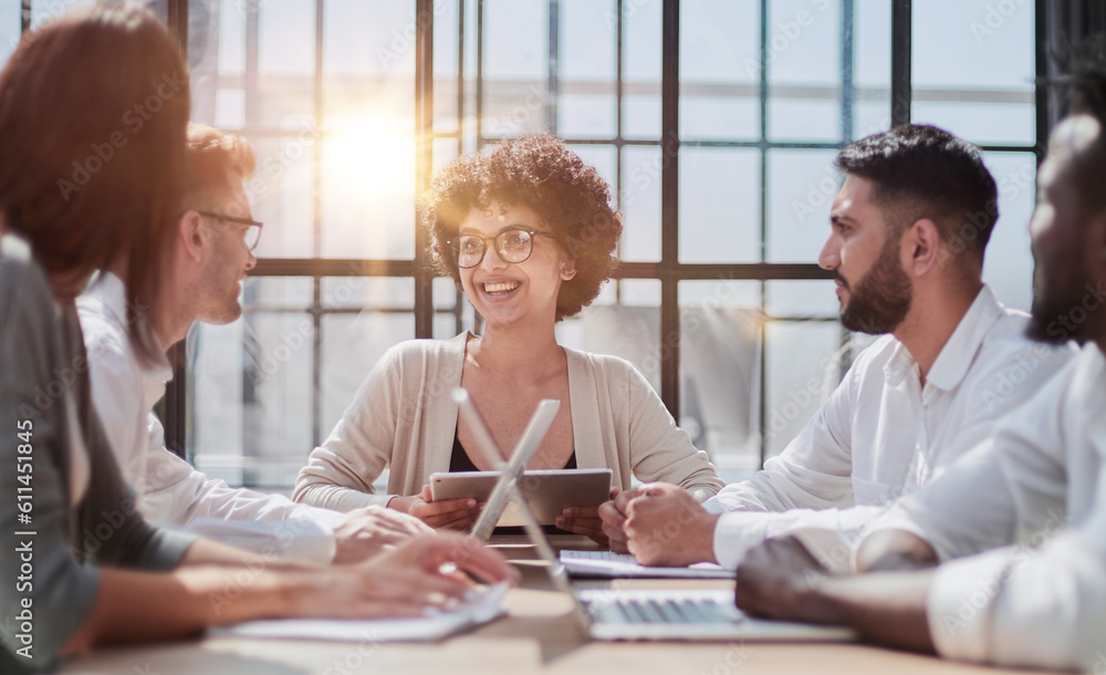 Fototapeta premium Employees working at computer together, discussing content