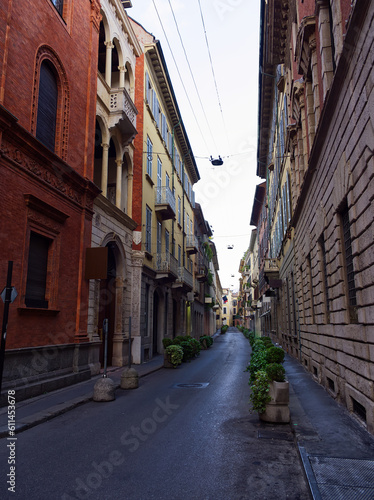 Pedestrian empty street with building facades, Milan, Italy