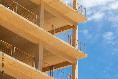 Close up of structural components of an engineered timber multi story green, sustainable residential high rise apartment building construction project