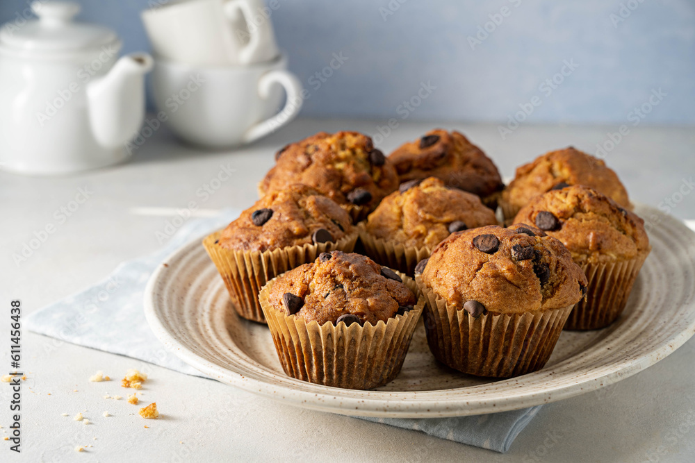 Chocolate chip muffins in a plate, home made pastry dessert, copy space Chocolate chip muffins in a plate, home made pastry dessert, copy space