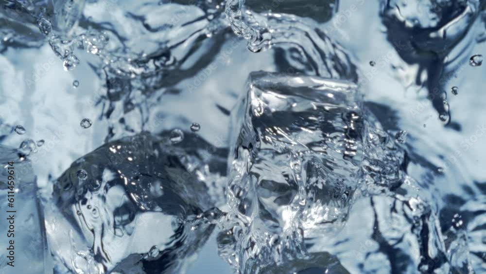 Super Slow Motion Shot of Falling and Splashing Perfect Ice Cubes into Water at 1000fps. Super Slow Motion Shot of Falling and Splashing Perfect Ice Cubes into Water at 1000fps.