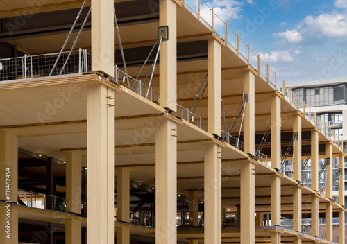Laminated wood floors and supports of a mass timber multi story green, sustainable, residential high rise apartment or office building construction project