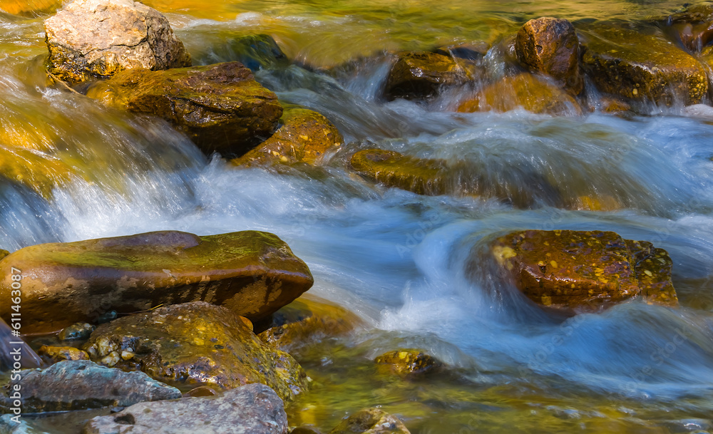 closeup small waterfall on the mountain river closeup small waterfall on the mountain river