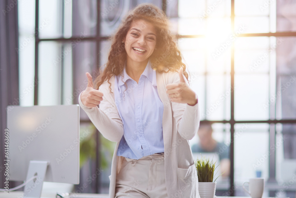 Proud office worker posing with thumbs up Proud office worker posing with thumbs up