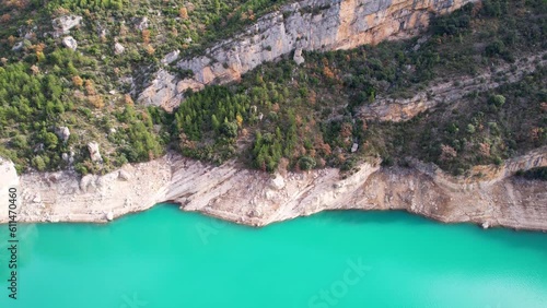 Panoramic beautiful vertiginous impressive aerial view of Montrebei gorge over Canelles reservoir, surrounded by vegetation on river in Catalonia, in Pyrenees, Spain.4K video. High quality 4k footage