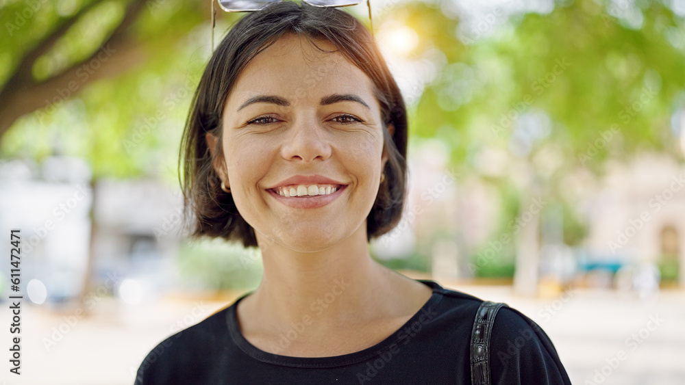 Young beautiful hispanic woman smiling confident standing at park