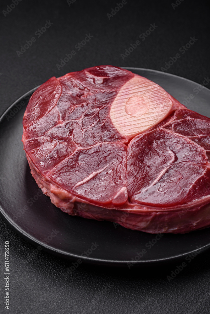 Fresh beef ossobuco steak with salt, spices and herbs Fresh beef ossobuco steak with salt, spices and herbs
