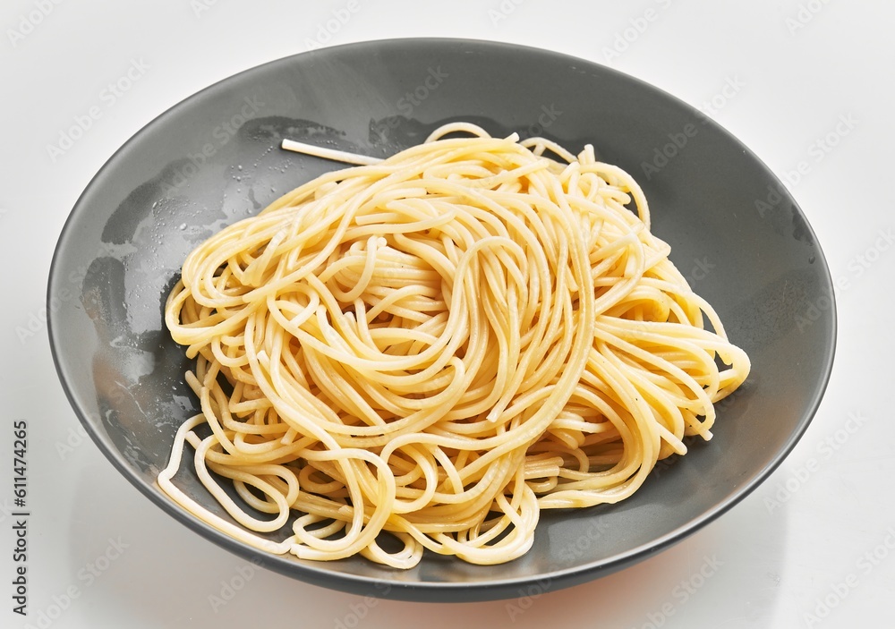 Delicious plate of italian spaghetti pasta over isolated white background Delicious plate of italian spaghetti pasta over isolated white background