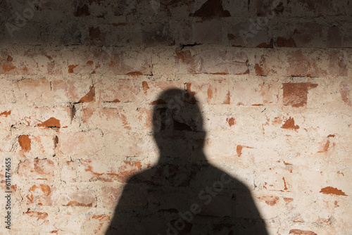 Shadows on red brick wall, abstract square interior background