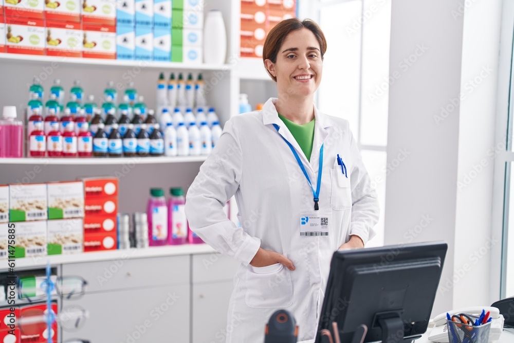 Young woman pharmacist smiling confident standing at pharmacy Young woman pharmacist smiling confident standing at pharmacy