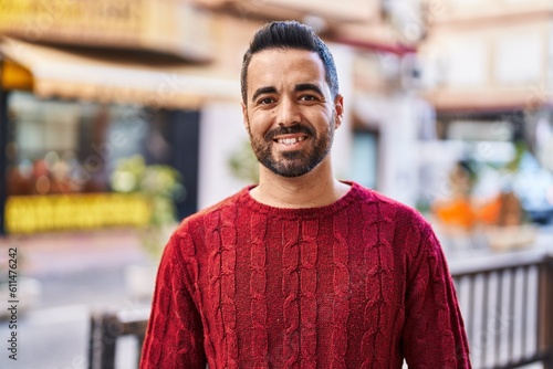 Young hispanic man smiling confident standing at street © Krakenimages.com