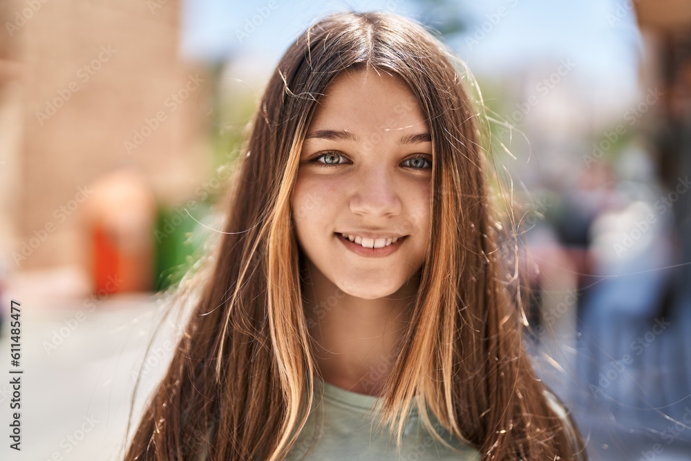 Adorable girl smiling confident looking to the camera at street Adorable girl smiling confident looking to the camera at street