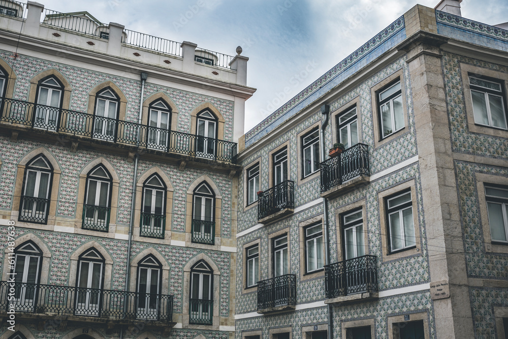 Classic apartment building with balconies and pattern on the walls in Lisbon, Portugal