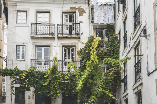 Classic old apartment building with balconies and some drying clothes in Lisbon, Portugal