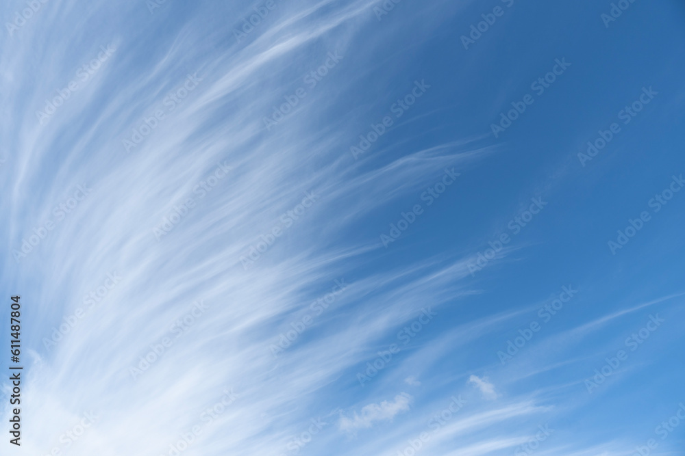 Cirrus clouds looking like brushed lines against blue sky during the day