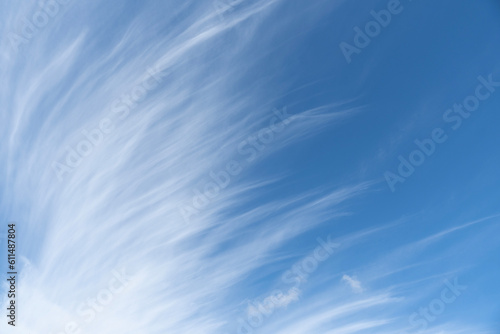 Cirrus clouds looking like brushed lines against blue sky during the day