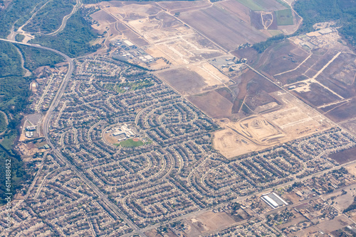 Eastvale, California, USA;  Aerial view of Eastvale california featuring Half Moon Park, Ronald Reagan Elementary School and Dairyland Park near the Santa Ana River photo