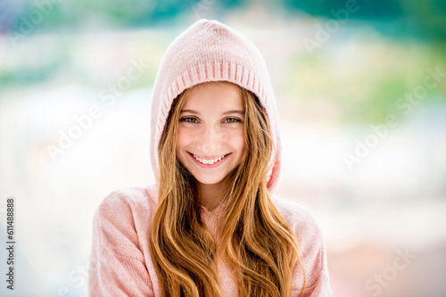 Beautiful teenage girl wearing hood photo