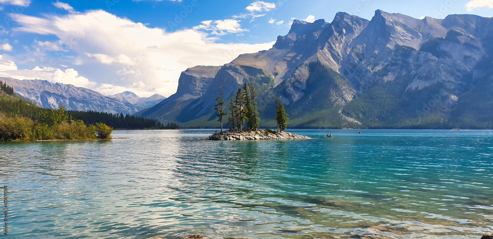 Pristine Lake Minnewanka in the Canada Rockies surrounded by mountains in Banff National Park