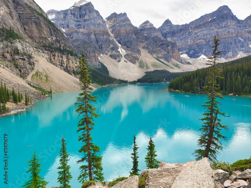 Turquoise blue waters of Moraine Lake surrounded by peaks in Banff National Park in the Canada Rockies