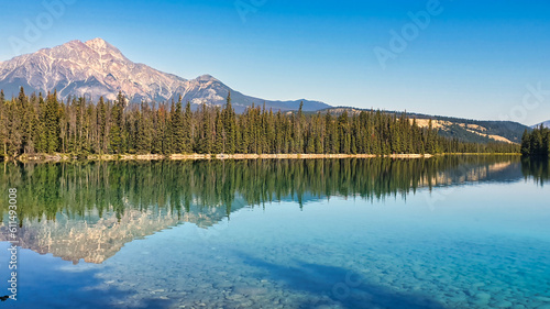 Pyramid Mountain is reflected in the pristine waters of the Pyramid Lake near Jasper town in the Canada rockies