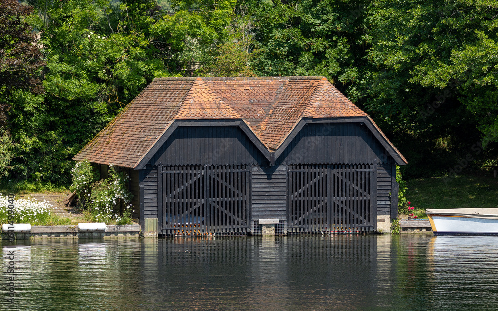 wooden boat house in the river