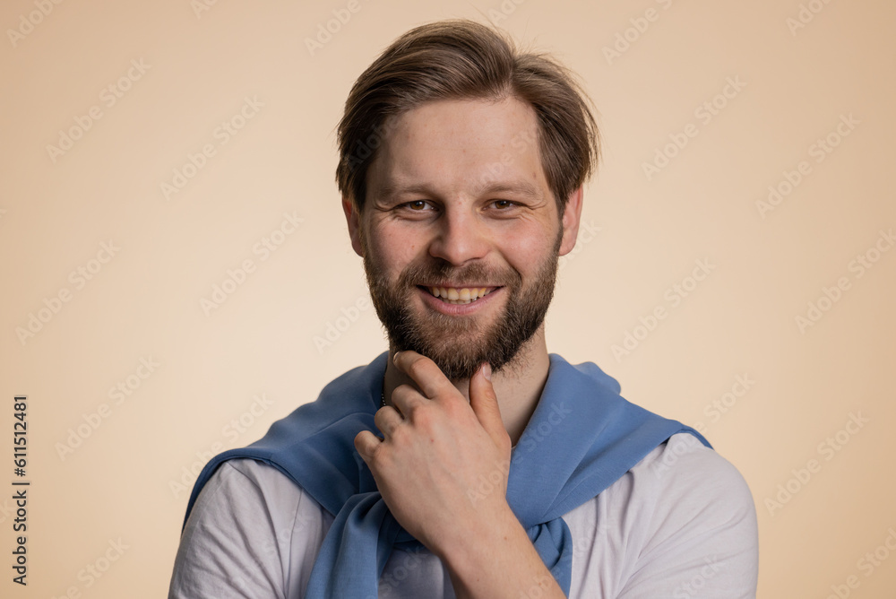 Portrait of happy calm caucasian man smiling friendly, glad expression looking away dreaming resting, relaxation feel satisfied concept good news, celebrate win. Guy on studio beige background indoor Portrait of happy calm caucasian man smiling friendly, glad expression looking away dreaming resting, relaxation feel satisfied concept good news, celebrate win. Guy on studio beige background indoor
