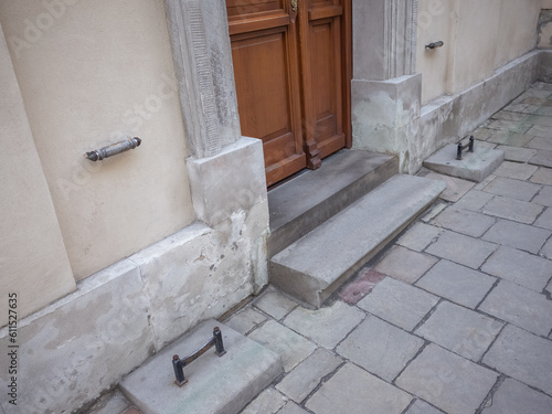 iron pieces set on the pavement to remove mad on the shoes in front of the door of cathedral in lviv old city