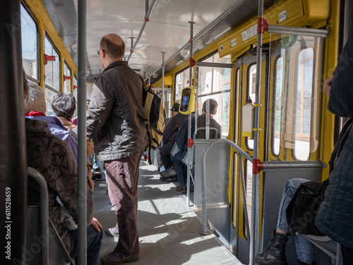 passengers in tram track running in lviv old city