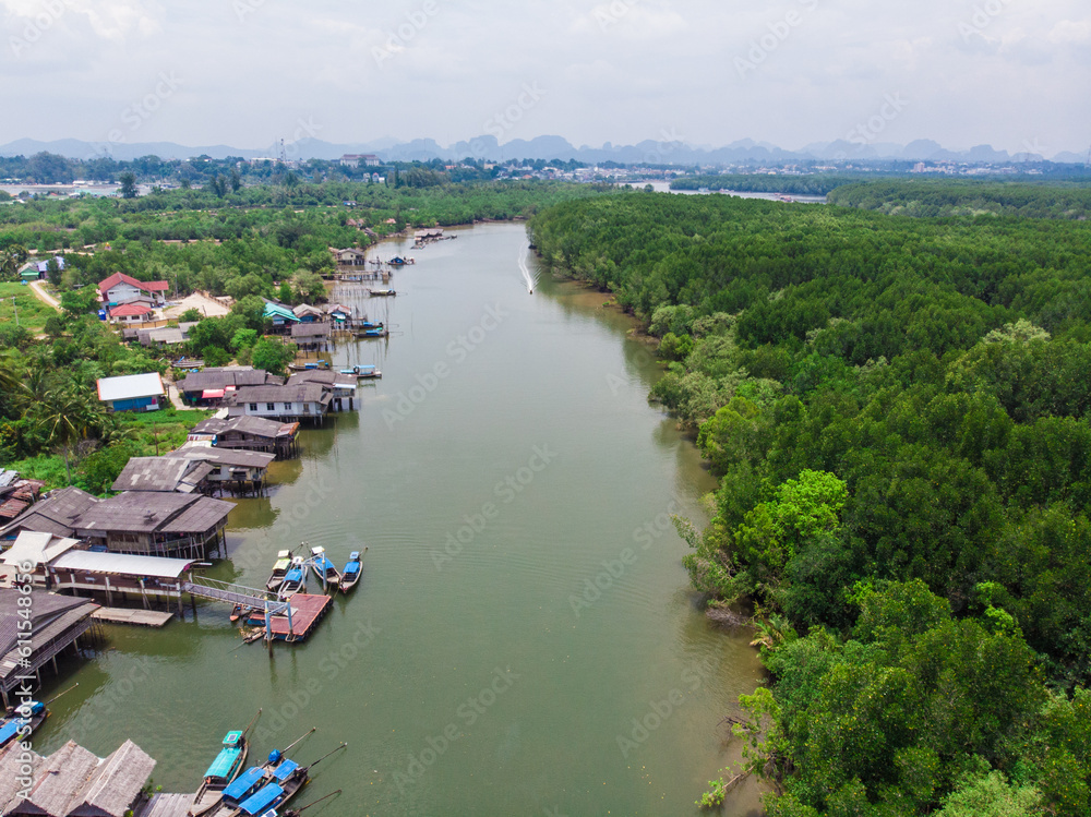 Aerial view traditional village in green tropical mangrove forest Aerial view traditional village in green tropical mangrove forest