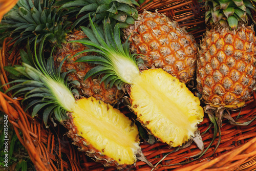 Basket full of fresh ripe pineapples
