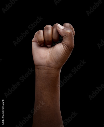 Human rights, protest and hand in fist for justice or solidarity, equality and support for a community. Fight for change, power. and revolution for freedom or empowerment on black or dark background