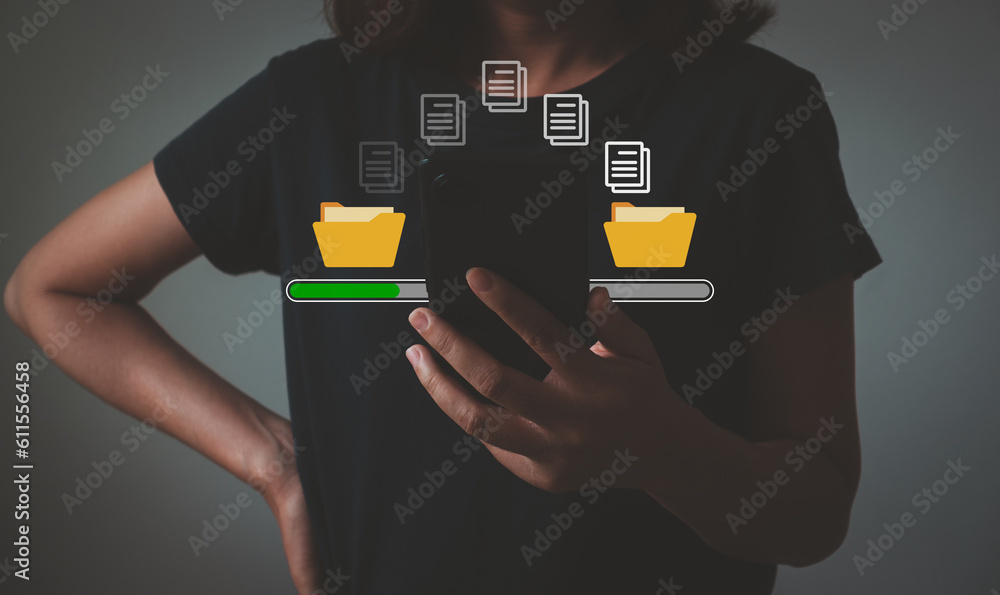 Woman using mobile phone waiting for transfer file process with loading bar icon on virtual screen. Data transfer, Transfer file, Backup data, Exchange of file on the folder, DMS. Virtual document. Woman using mobile phone waiting for transfer file process with loading bar icon on virtual screen. Data transfer, Transfer file, Backup data, Exchange of file on the folder, DMS. Virtual document.