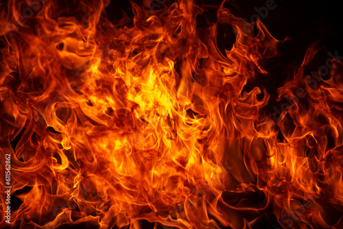 Texture of fire on a black background. Abstract fire flame background, large burning fire.