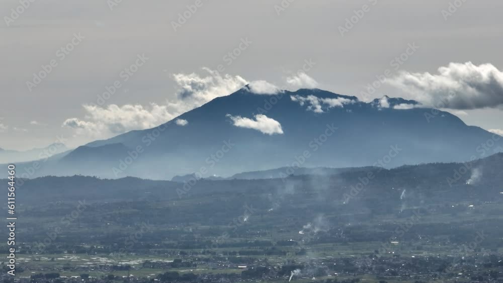 Farmland with growing crops of rice, vegetables in a mountain valley. Sumatra. Indonesia. Farmland with growing crops of rice, vegetables in a mountain valley. Sumatra. Indonesia.