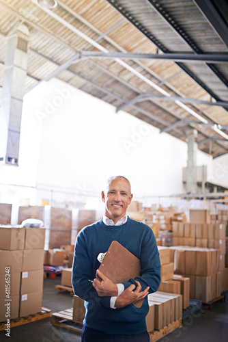 Manager, smile and portrait of man in warehouse for cargo, storage and shipping. Distribution, ecommerce and logistics with employee in factory plant for supply chain, package or wholesale supplier photo