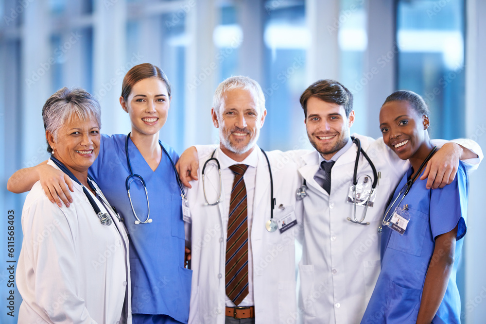 Healthcare, team and portrait of doctors and nurses standing in a corridor of the hospital. Confidence, diversity and happy professional medical workers with smile in collaboration in medicare clinic Healthcare, team and portrait of doctors and nurses standing in a corridor of the hospital. Confidence, diversity and happy professional medical workers with smile in collaboration in medicare clinic