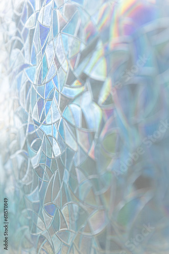 blue background with colourful shapes, decoration on the glass window, under sunlight