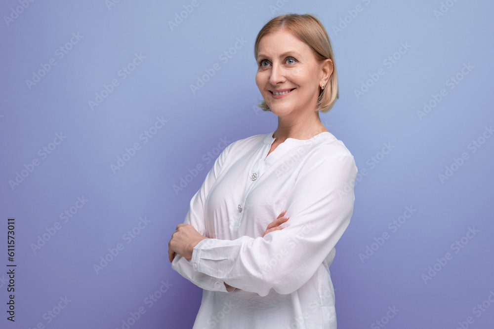 kind pleasant blond mature woman with clean face at menopause age in studio background kind pleasant blond mature woman with clean face at menopause age in studio background