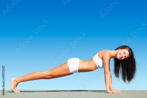 Woman, pushup and fitness with healthy body, sky or happiness in mockup space, workout or sunshine. Girl, smile and plank for mock up, exercise or freedom for wellness, self care or underwear on roof