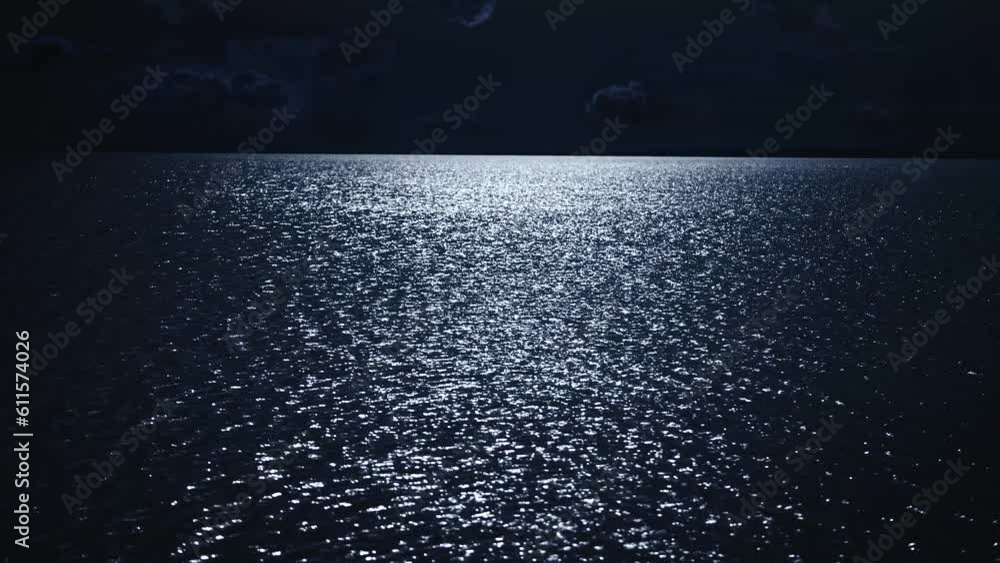 Night scene. The moon is reflected in the water, the moon path on the surface of the river. Night scene. The moon is reflected in the water, the moon path on the surface of the river.