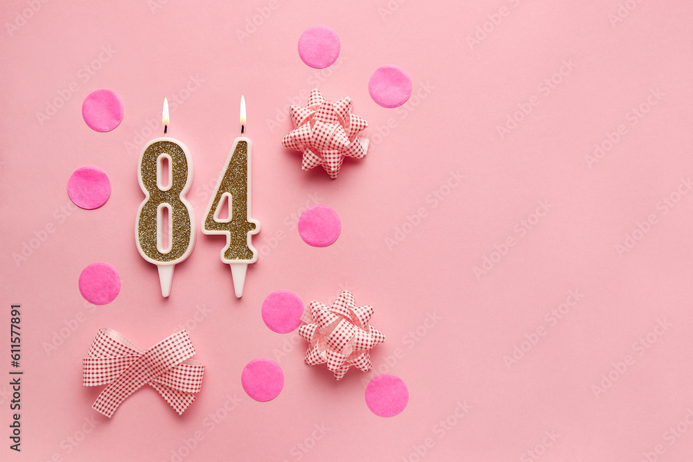 Number 84 on pastel pink background with festive decor. Happy birthday candles. The concept of celebrating a birthday, anniversary, important date, holiday. Copy space. banner Number 84 on pastel pink background with festive decor. Happy birthday candles. The concept of celebrating a birthday, anniversary, important date, holiday. Copy space. banner