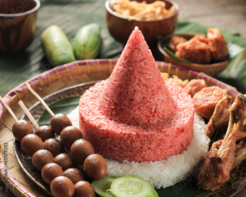 Red and White Rice Called Nasi Tumpeng Same as Indonesian National Flag for Independence Day Celebration at 17 August photo